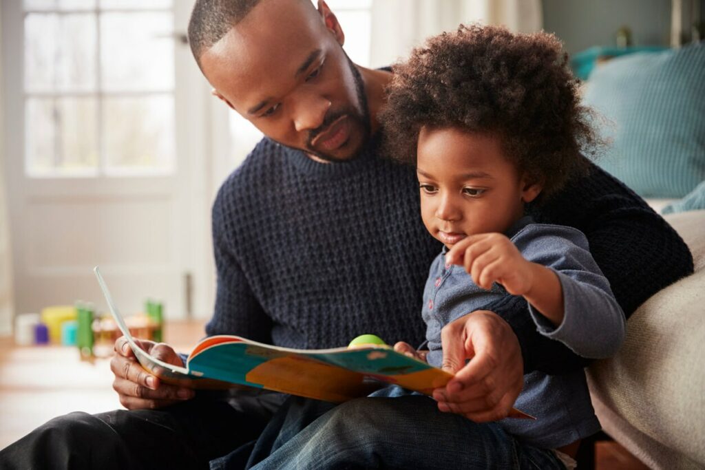 Adult Male and child reading on the Zebra Comics blog